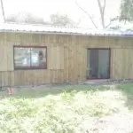 agencement extérieur : extension d'une maison en ossature bois et pose des menuiseries extérieures